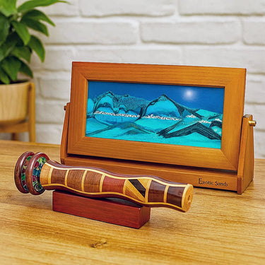 Wood-framed blue moving sand art with a handcrafted wooden kaleidoscope bright, modern lifestyle setting