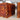 Wooden puzzle box with intricate design on a blurred background