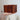 Hand holding a wooden box with dovetail joints against a neutral background