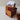 Wooden puzzle box with a stack of cards on top