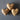 Three wooden hearts with 'hope', 'faith', and 'love' inscribed on a gray background
