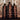 Three Alpha by Johnny Cliche bottles on a decorative background