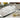 Decorative metal tray with floral patterns on a table setting.
