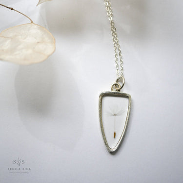 Botanical Necklace with a unique pendant on a light background