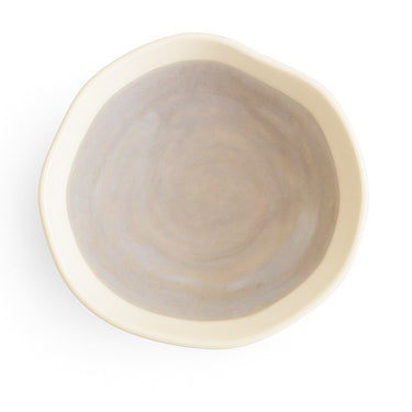 Beige ceramic bowl on a white background