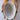 Person holding a white ceramic bowl against a plain background