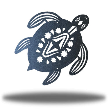 Decorative metal turtle with star and flower patterns on a white background