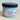 Jar of 'Beach Babe' whipped body scrub with a black lid on a light background