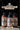 Three bottles of 'Beast Wash' shower set with labels on a dark background