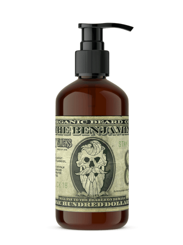 Bottle of organic beard oil with a label resembling a dollar bill on a black background