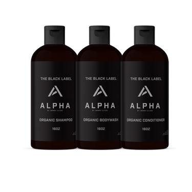 Three Alpha Black Label bottles for organic shampoo, bodywash, and conditioner on a white background