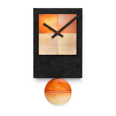 Black Tie pendulum wall clock by Leonie Lacouette, black wood with copper face and swinging pendulum.