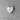 Heart-shaped rubber stamp with a ribbon design on a gray surface