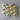 Wooden hearts with green ribbons on a gray surface