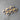 Wooden heart-shaped pins with blue ribbons on a gray surface