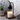 Candle Warmer Lamp Black and Wood Black on a table with a white candle on a wooden base next to a potted plant and bowls.
