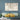Map of Chesapeake, Virginia on a wall above a blue sofa with yellow and green cushions.