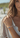Woman wearing a colorful bracelet on a blurred beach background