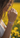 Woman wearing a colorful bracelet with a blurred yellow flower field background