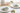 Elegant table setting with white plates, silverware, and decorative napkins on a light background.