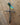 Metallic dragonfly Vine cross on a wooden surface