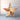 Wooden star with musical notes and text on a light wooden background