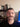 Man with a mustache making a face in front of a computer screen