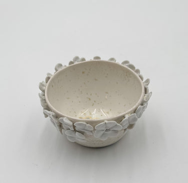 Ceramic bowl with floral patterns on a white background