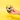 Hand holding a wine glass with floral design against a yellow background