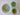 Three ceramic bowls with green and beige patterns on a white background