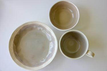 Three ceramic bowls of different sizes on a white background