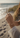 Hand with a bracelet on a beach