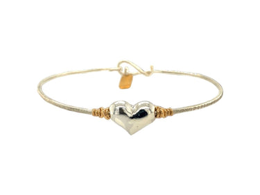 Gold and silver heart-shaped bracelet on a white background