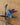 Blue hummingbird figurine on a wooden surface