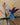 Blue and purple hummingbird figurine on a wooden surface