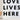 Decorative sign with 'LOVE LIVES HERE' text on a marble-patterned background