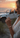 Woman wearing a bracelet with a sunset and Jeep in the background