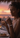 Woman at a dinner table with a sunset in the background
