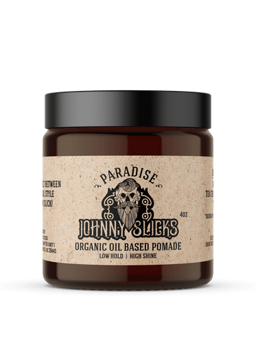Jar of Johnny Slicks organic oil-based pomade with a black lid on a white background
