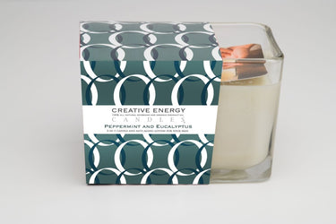 Peppermint & Eucalyptus Soy Lotion Candle with a decorative box labeled 'Creative Energy' on a white background