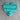 Turquoise heart-shaped object on a beige surface