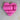 Pink heart-shaped object on a textured surface