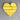 Yellow heart-shaped object on a textured surface