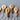 Wooden keychains with colorful designs on a gray surface