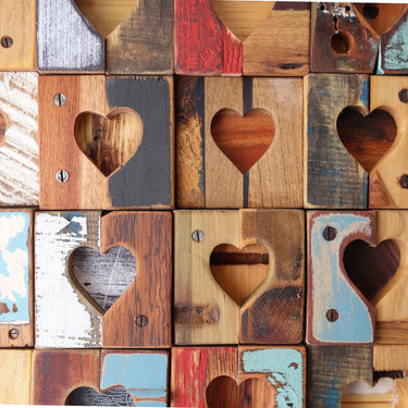 Wooden blocks with heart shapes arranged in a grid pattern.