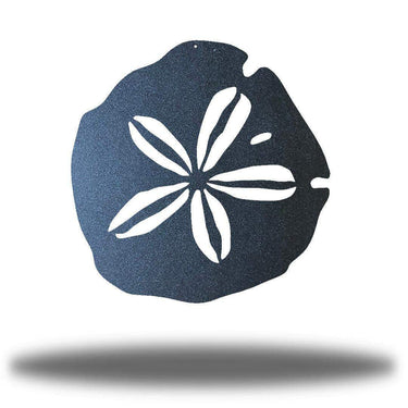 Decorative metal sand dollar with white floral design on a white background