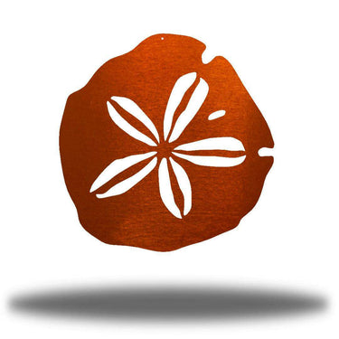 Decorative metal sand dollar with white floral design on a white background