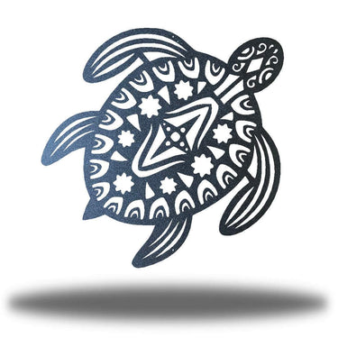 Decorative metal turtle with tribal patterns on a white background