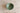 Green ceramic bowl on a wooden surface