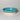 teal ceramic bowl on a gray background